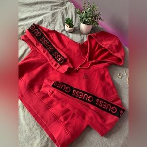 Red Hoodie with Brand on Sleeves.